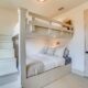 bedroom with built in bunks and coastal look