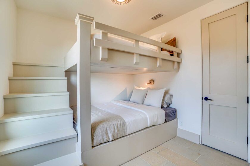 bedroom with built in bunks and coastal look