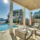 view of pool and water from deck seating