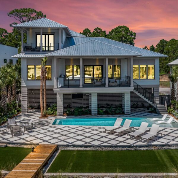 Back of house with pool and deck