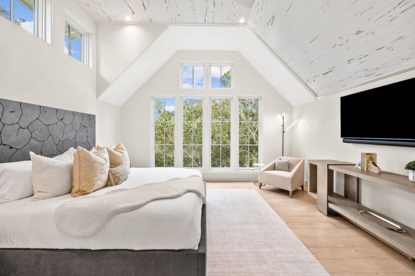 bedroom with tall ceilings, picture window