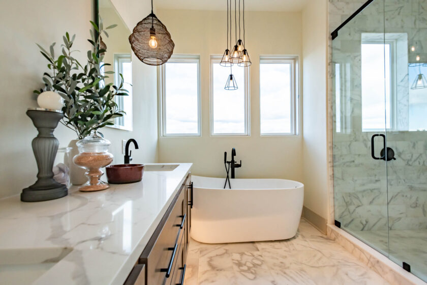 vanity, soaking tub, and walk in shower