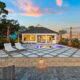 House and deck with lounge chairs.